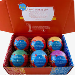 Two Sisters bubble bath water with bright colors and bubbles in tub.