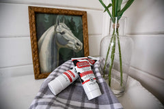Udderly Smooth label close-up highlighting non-greasy, fast-absorbing formula