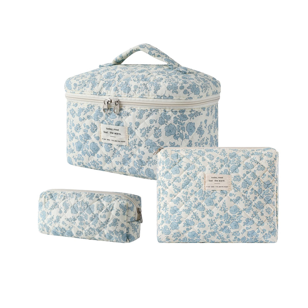 uekeboag 3pcs large travel-quilted makeup bags in light blue ideal for organized cosmetics on trips.