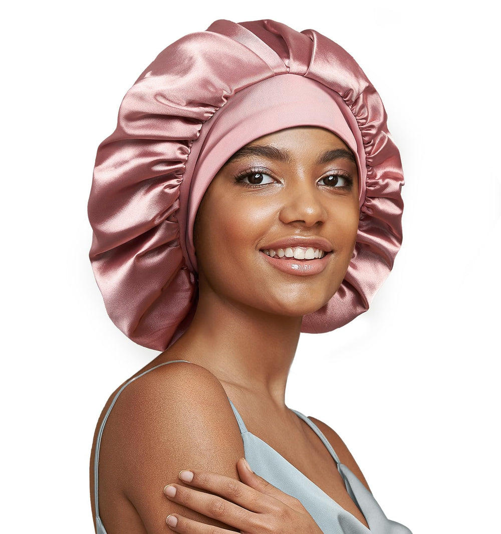 UmiSleep 22momme silk bonnet pink on bed reduces friction for smooth hair overnight.