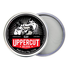 Uppercut Deluxe Clay water-based formula captured mid-application for easy wash-out.