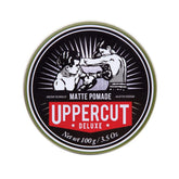 Uppercut Deluxe Matte Pomade jar closeup shows creamy texture for easy styling