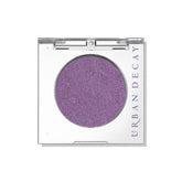 Urban Decay 24/7 Eyeshadow Single Freebird compact shows sheer lilac shimmer for everyday looks.