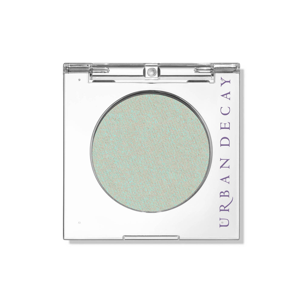 Urban Decay 24/7 Lucid teal eyeshadow close-up shows teal shimmer for an evening look.