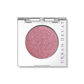 Urban Decay 24/7 Bad Seed powder swatch shows warm pink shimmer for versatile looks