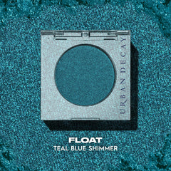 Urban Decay 24/7 Longwear Eyeshadow Single Float teal shimmer closeup highlights creamy, velvety texture.