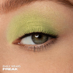Urban Decay Freak swatch shows long-wearing lime shimmer on the arm