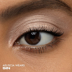 Urban Decay 24/7 Eyeshadow Single Sin Champagne Shimmer swatch shows high-pigment payoff.