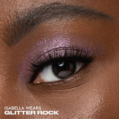 Urban Decay Moondust Space Cowboy swatch reveals champagne-gold sparkle for versatile glam.