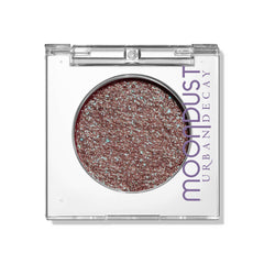 Urban Decay Moondust Solstice close-up highlights red-green sparkle for vibrant eyes.
