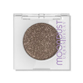 Urban Decay Moondust Space Cowboy swatch shows champagne gold sparkle for bridal glow