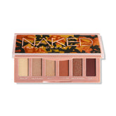 URBAN DECAY Naked Mini Half Baked palette front shows a compact travel-friendly design for bronze eye looks