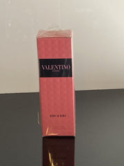 Valentino Donna Born In Roma mood shot emphasizes vanilla and woods warmth.