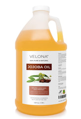 Velona Jojoba Oil bottle close-up reveals golden hue for skin hydration.