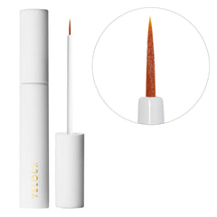 Velour Strong Eyelash Glue with brush-on applicator and white bottle for precise, mess-free application.