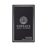 Versace Pour Homme bottle on dresser shows timeless daily elegance.