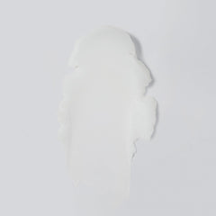 Versed Day Dissolve balm on wet hands showing makeup-melting action