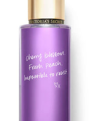 Victoria's Secret Love Spell fragrance label highlights cherry blossom and peach hints.