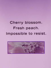 Victoria's Secret Love Spell Nourishing Lotion label closeup highlights branding and moisture benefits.