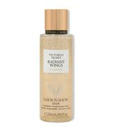 Victoria's Secret Radiant Wings bottle close-up, showcasing shimmering floral gourmand fragrance for the skin.