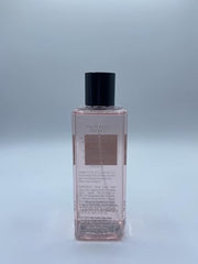 Close-up of Victoria's Secret Tease Mist notes: gardenia, pear, vanilla for a warm, inviting aroma.