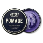Victory Barber & Brand Pomade jar closeup showing firm hold for polished styles.