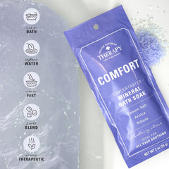 Village Naturals Therapy comfort-mineral-bath-packets closeup reveals arnica-berry-ginger ingredients for revitalizing soak.