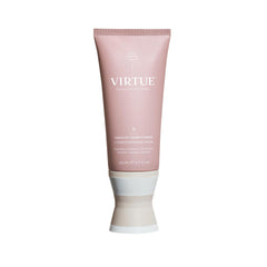 Virtue Smooth Conditioner bottle pours, signaling frizz-control prep in your shower routine.