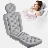 VOXOR full body bath pillow top view shows neck and back support in a spa-like setup
