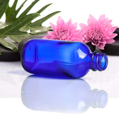 Wedama 2oz glass spray bottle blue cap ready for clean, controlled dispensing.