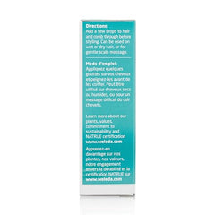 Weleda Rosemary Conditioning Hair Oil on hair strands for smooth, manageable style.