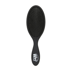 Wet Brush Original Detangler Black Frost in hand showing easy knot detangling.