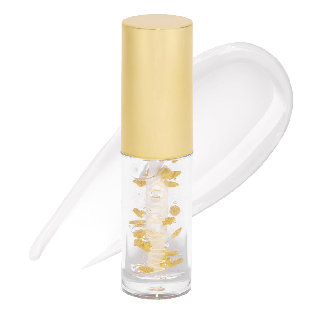 Winky Lux In The Stars Lip Oil tube swirl delivers silky shine and hydration.