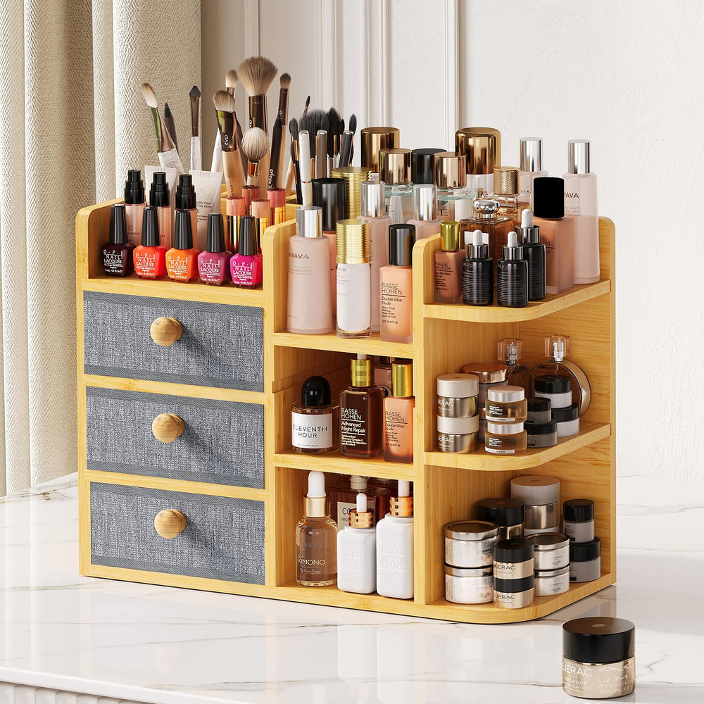 X-cosrack large bamboo makeup organizer with brush holders keeps beauty tools neatly within reach.