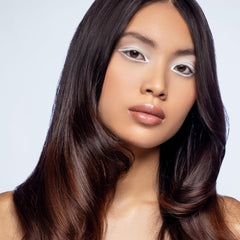 Close-up of XMONDO Hair Forcefield bottle showcasing brilliant shine and protection.