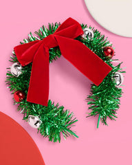xo, Fetti wreath headband close-up with red ornaments for holiday charm