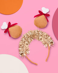 xo, Fetti turkey legs detail on headband highlight plush legs for playful holiday flair.