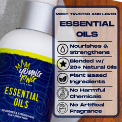 Hands applying YOUNG KING HAIR CARE oils to soften curls and reduce frizz