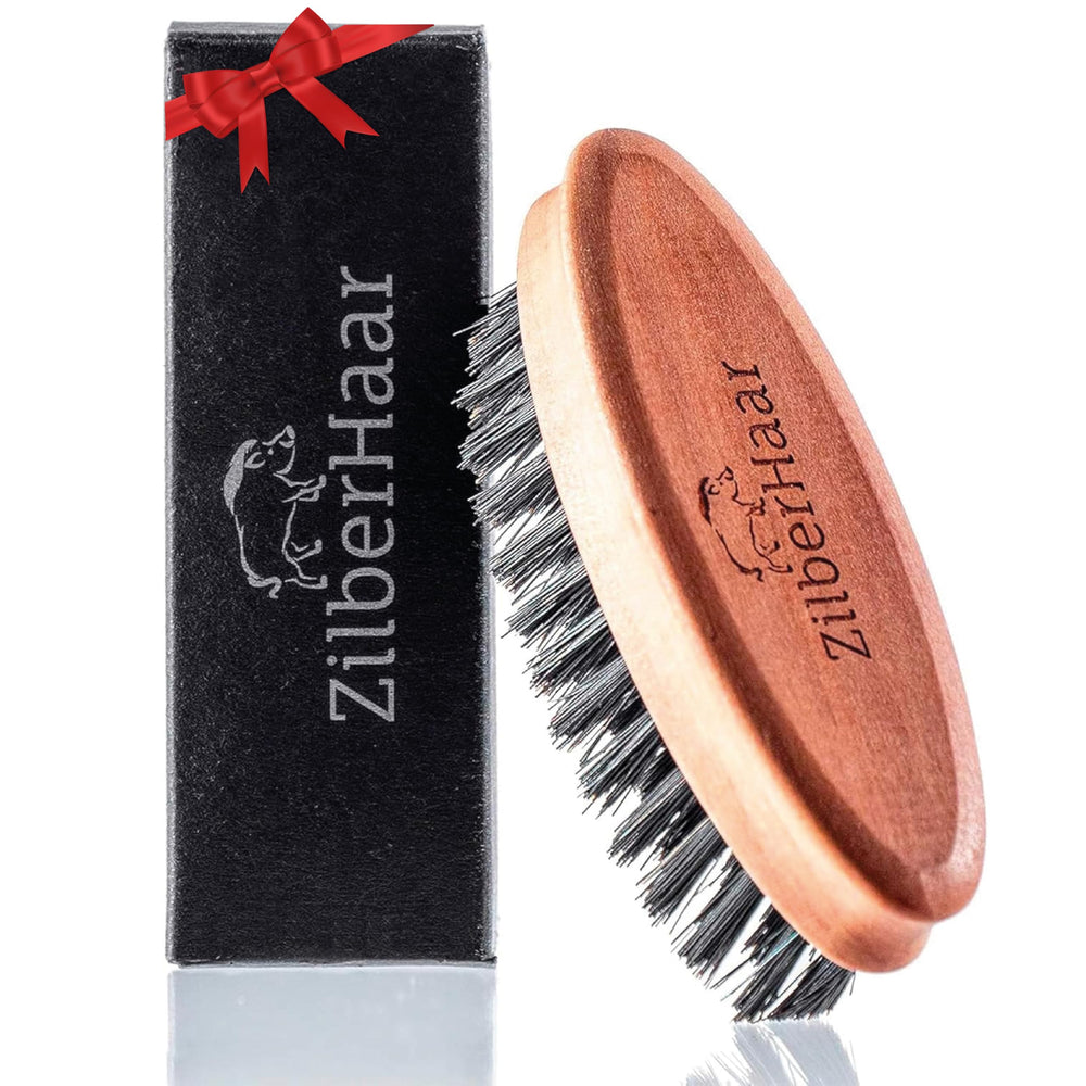 ZilberHaar pocket beard brush with soft boar bristles and pearwood handle for gentle balm distribution.