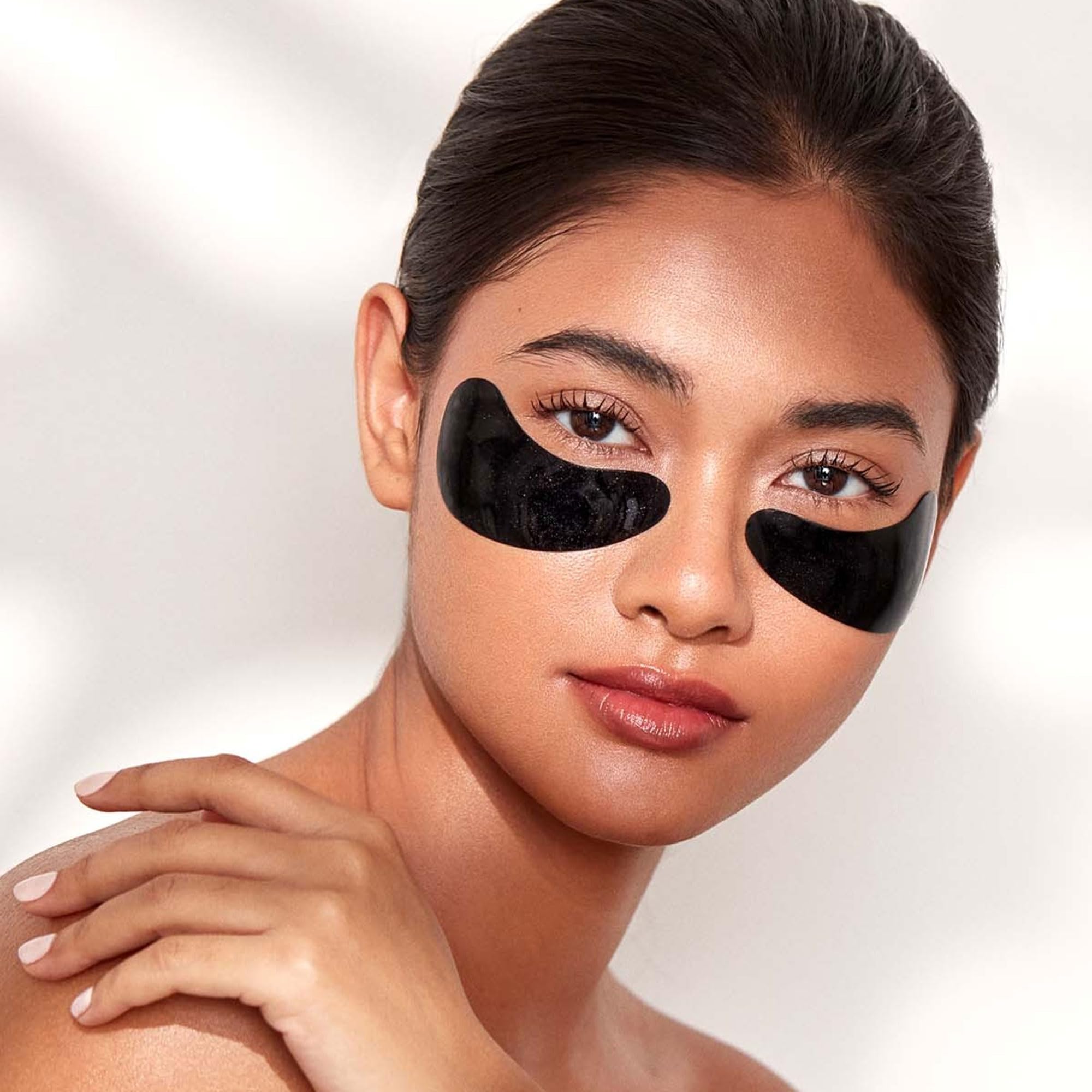 111SKIN Black Diamond Eye Mask in use under eye for soothing routine