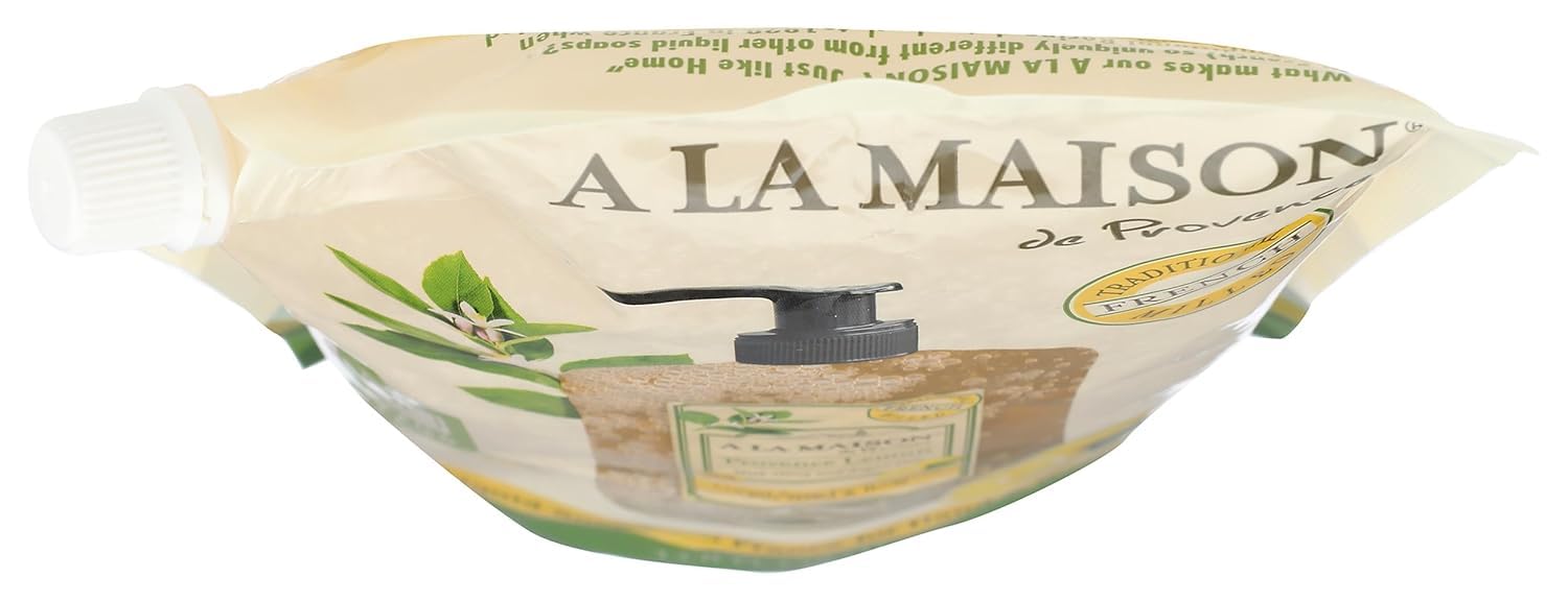 A La Maison Provence Lemon Liquid Soap refilling bottle with reusable container nearby.