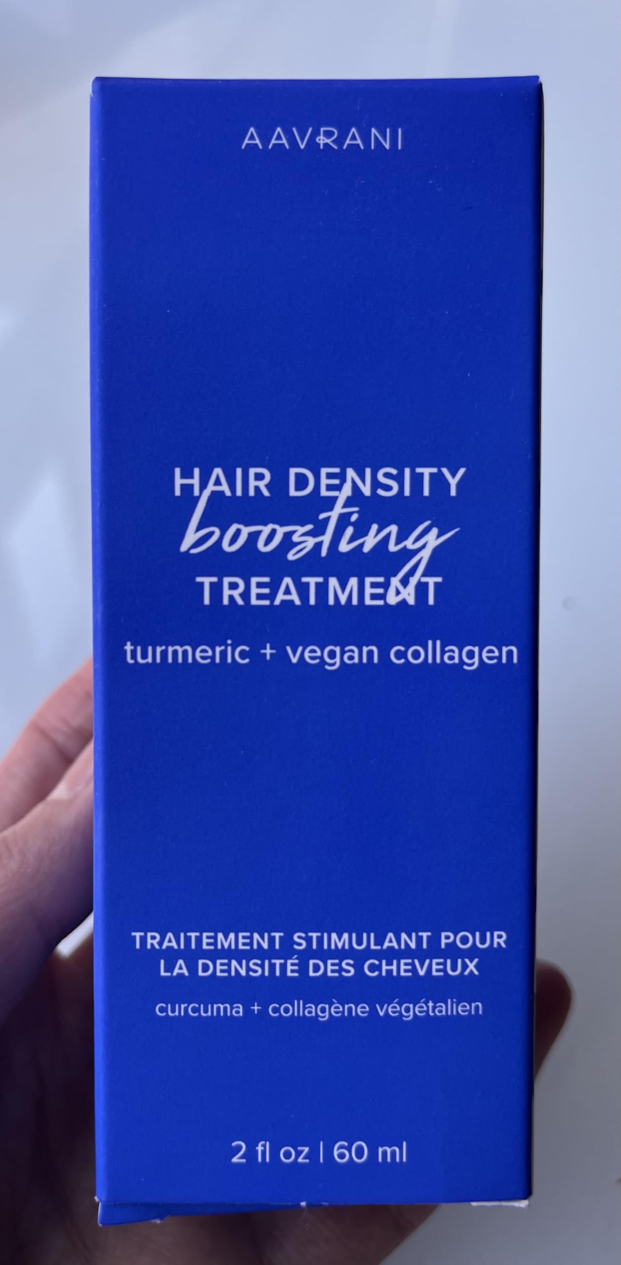 AAVRANI lightweight non-greasy formula texture shown on palms.