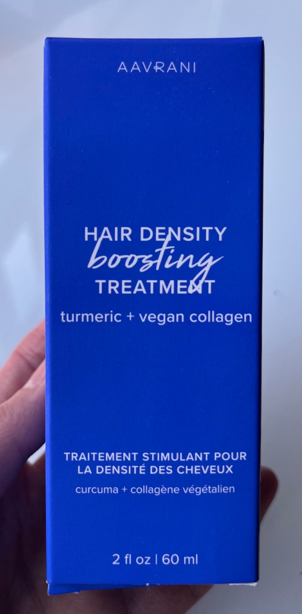AAVRANI lightweight non-greasy formula texture shown on palms.
