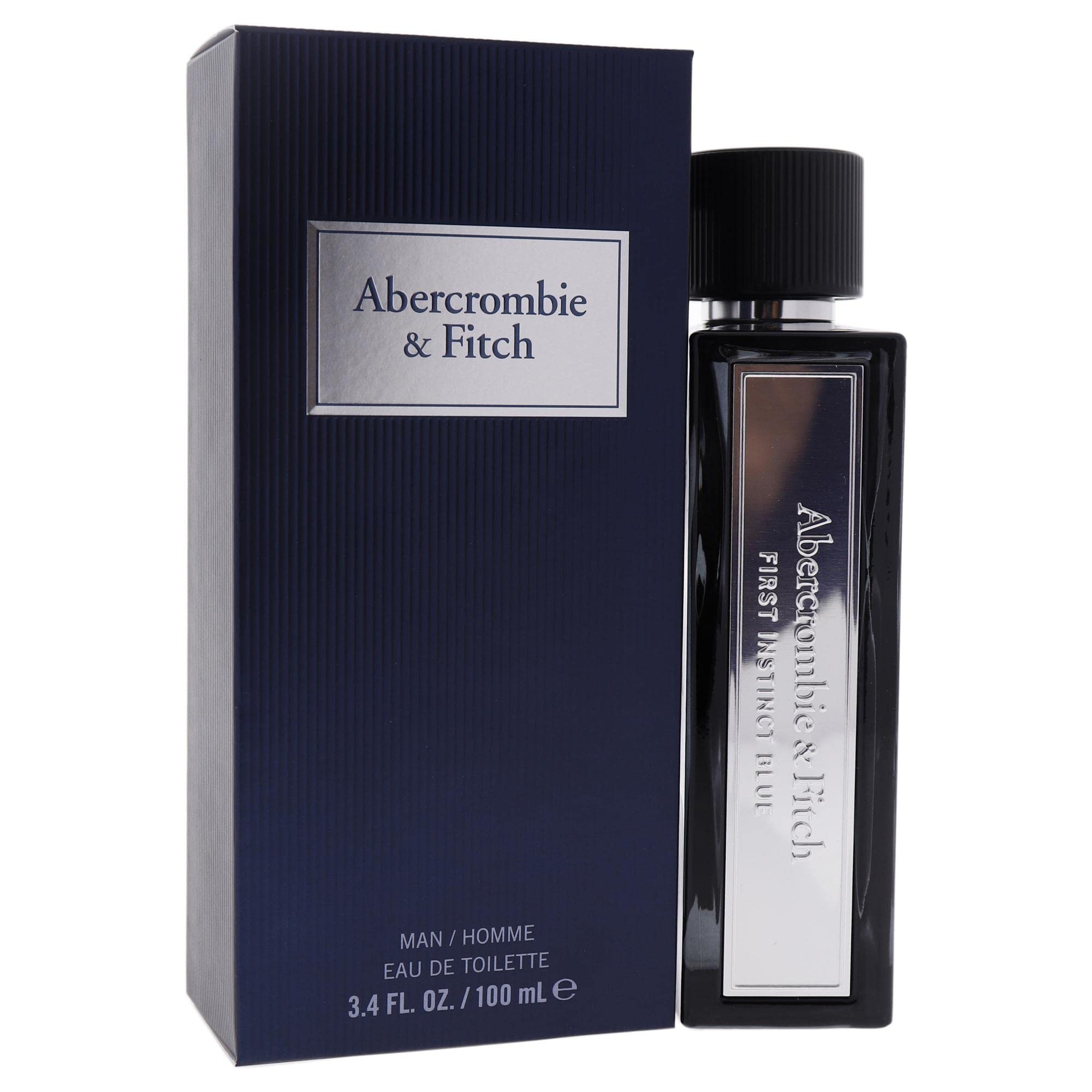 First Instinct Blue glass bottle under soft lighting communicates premium masculine scent.