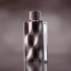 Abercrombie & Fitch First Instinct Extreme liquid glow shows warm amber tones for night-out vibes.