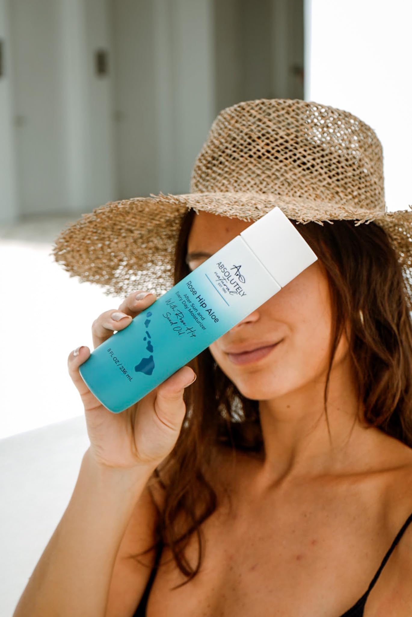 Absolutely Natural after-sun lotion application on arm showing quick absorption