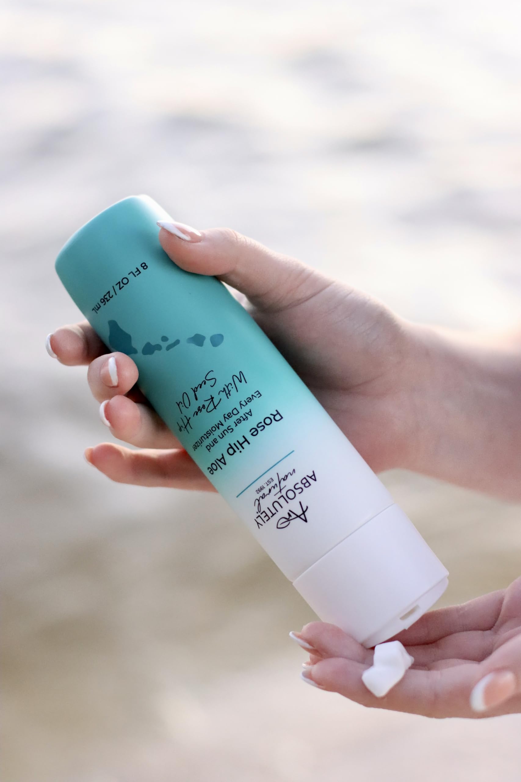 Absolutely Natural lotion bottle on natural surface for everyday use