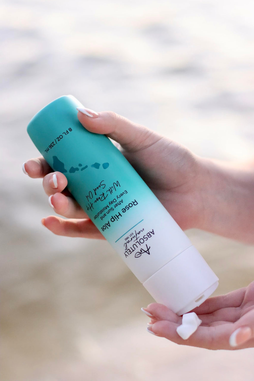 Absolutely Natural lotion bottle on natural surface for everyday use