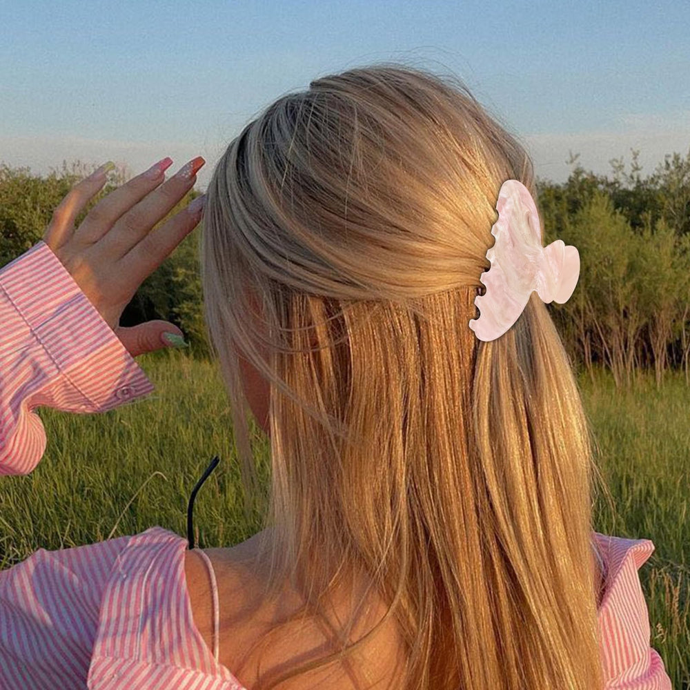 ACO-UINT hair clip holds hair in chic updos for errands.