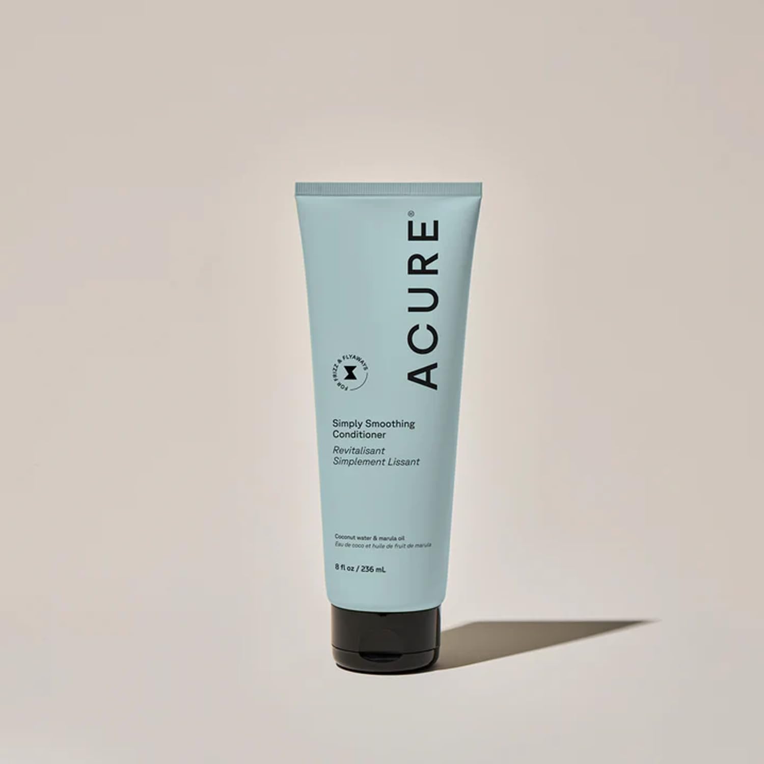 Acure Simply Smoothing Shampoo lather close-up illustrates gentle cleansing for dry hair.